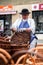 Senior craftsman while weaving wicker basket. Traditional Slovak folk craft