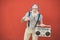 Senior crazy man with boombox stereo playing rock music - Trendy mature guy having fun dancing with vintage radio - Joyful elderly