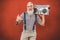 Senior crazy man with boombox stereo playing rock music - Trendy mature guy having fun dancing with vintage radio - Joyful elderly