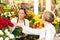 Senior customer buying red roses flower shop