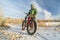 Senior cyclist is riding a fat bike