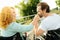 Senior disabled man kissing a hand of his loving wife