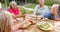 Senior diverse group of women enjoying a meal outdoors