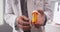 Senior doctor holding prescription bottle