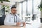 Senior doctor, writing and portrait of a hospital worker in a office doing medical research. Happiness, laptop and