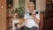 Senior elderly caucasian man doing weight lifting dumbbell exercising at home