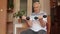 Senior elderly caucasian man doing weight lifting dumbbell exercising at home