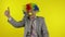 Senior elderly clown businessman freelancer in wig show thumb up. Halloween