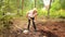 Senior elderly gardener woman digging caring ground level at summer farm countryside outdoors using garden tools rake