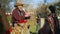 Senior farmer gives goods in paper eco bag