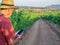 Senior farmer inspects the quality of the vineyard with a phone. Agriculture concept