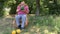 Senior farmer shows his organic water-melon while sitting in a wicker chair