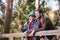 Senior father and his son on walk in nature, standing and talking.