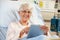 Senior Female Patient Relaxing In Hospital Bed