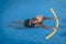 Senior female woman holds on to a flotation device on a swimming pool to learn how to swim