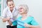 Senior Female Working With Physiotherapist