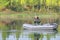 Senior fishing from his boat on a sunny autumn day