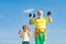 Senior fitness man training with dumbbells isolated on blue background. Age is no excuse to slack on your health