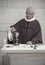 A Senior French Catholic priest is giving mass during a baptism in Aquitaine