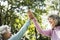 Senior friends exercising outdoors happily