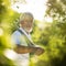 Senior gardener holding a digging fork