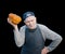 Senior gardener with a pumpkin. The 87 - year-old farmer enjoys the pumpkin harvest in the garden. Cheerful active old man by