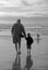Senior Grandfather and Child Silhouette on Beach in BW