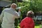 Senior grandfather holds green toy airplane