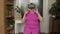 Senior grandmother putting on virtual headset glasses and watching 3d video in 360 vr helmet at home