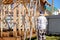 Senior gray-haired builder inspects the frame of a standing country house