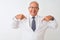 Senior grey-haired scientist man wearing coat standing over isolated white background looking confident with smile on face,