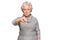 Senior grey-haired woman wearing casual winter sweater looking unhappy and angry showing rejection and negative with thumbs down