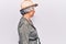 Senior grey-haired woman wearing explorer hat looking to side, relax profile pose with natural face with confident smile