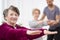 Senior grey woman exercising at hospital physiotherapy center