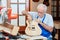 Senior guitar maker makes new guitar