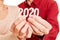 Senior hands show year 2020 as a number