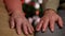 Senior hands of woman and man resting in front of christmas tree waiting