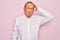 Senior handsome grey-haired man wearing elegant shirt over isolated pink background confuse and wonder about question