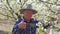 senior happy farmer with hat showing thumb up sign