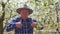 senior happy farmer with hat showing thumb up sign