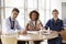 Senior healthcare workers in a meeting looking to camera