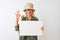 Senior hiker woman wearing canteen hat holding banner over isolated white background doing ok sign with fingers, excellent symbol