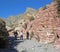 Senior hikers and Aztec sand stone rock formation