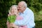 Senior husband giving bouquet of tulips to his wife