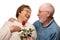 Senior Husband Giving Red Rose to Wife