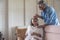 Senior husband take care and comforting ill wife in living room .- retired elder lover couple lifestyle
