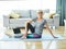 senior indoor exercise woman training lifestyle sport fitness home healthy gym exercising fit laptop