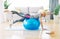 senior indoor exercise woman training lifestyle sport fitness home healthy gym exercising fit laptop ball