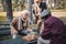 Senior interracial friends playing chess near