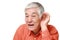 Senior Japanese man with hand behind ear listening closely